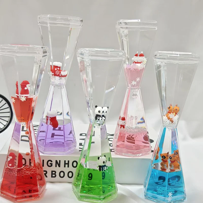 Welke materialen worden gebruikt voor de buitenste schil van een druppelornament met vloeibare olie?