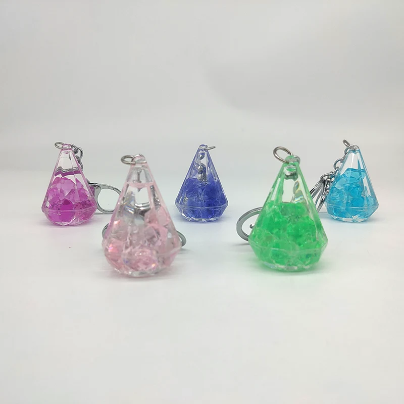 Kleine diamanten drijfzand sleutelhanger